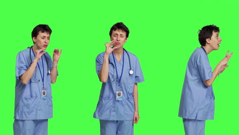 Medical-assistant-asking-to-keep-quiet-and-be-silent-against-greenscreen